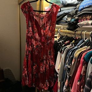 Red floral dress size 0 torrid brand and can be worn off the shoulder